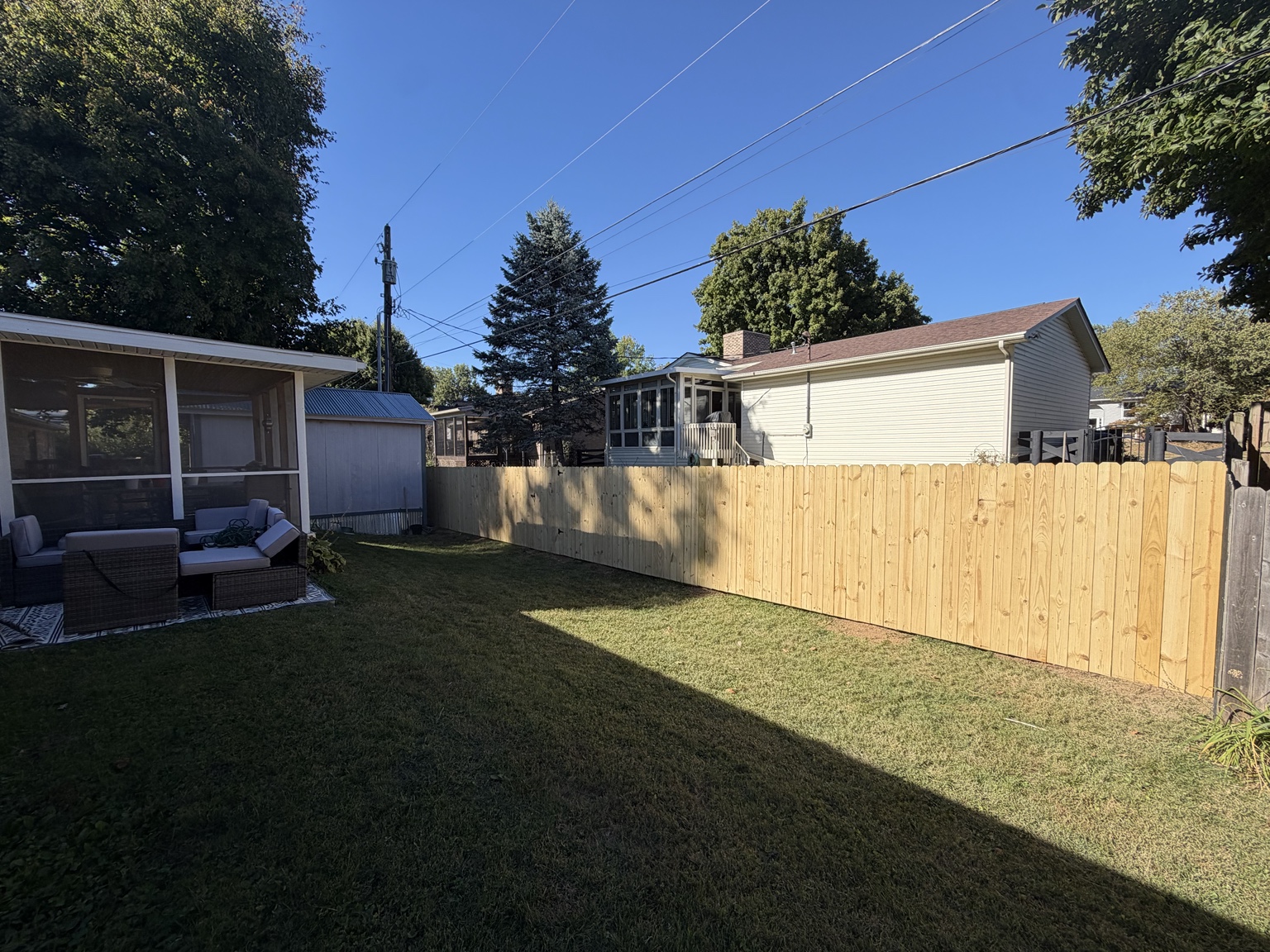 New wooden privacy fence along a residential backyard